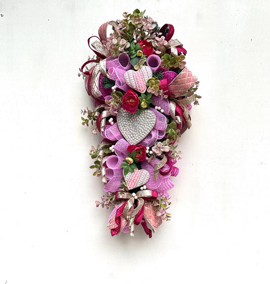 Elevate your home decor with this luxury pearl and rhinestone heart wreath accented with peonies and designer ribbons for your front door.