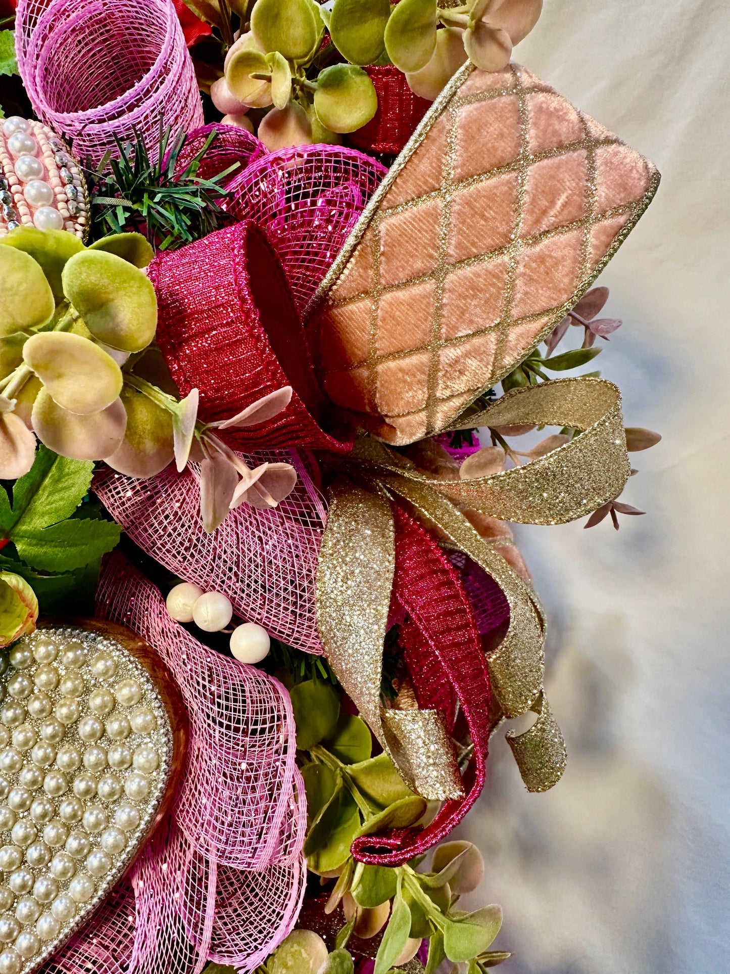 Elevate your home decor with this luxury pearl and rhinestone heart wreath accented with peonies and designer ribbons for your front door.