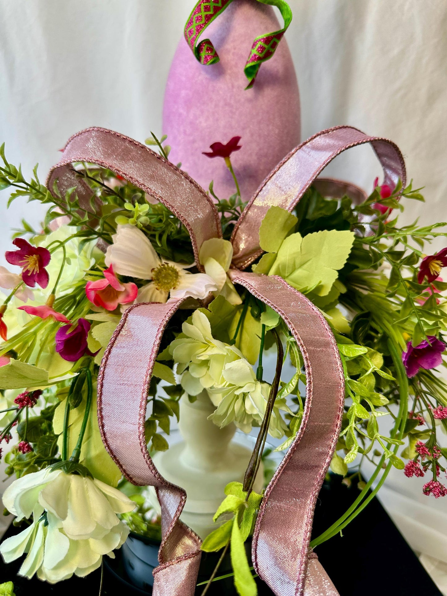 Elevate your Easter Home Decor with this enchanting Flocked Bunny Candlestick Centerpiece on a surrounded by Ribbon and Wispy Flowers.
