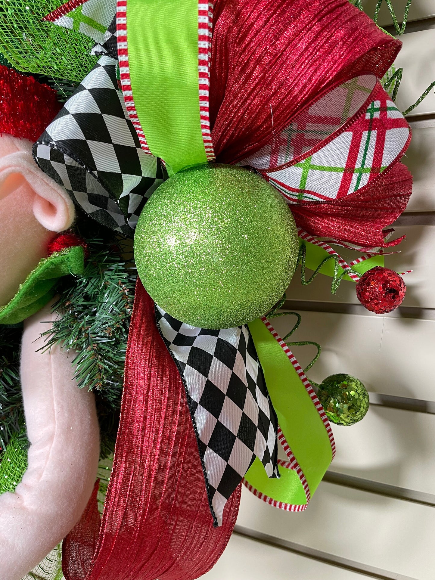 Whimsical Red and Green Christmas elf wreath perfect for front door, porch door, gift or juvenile with 4 ribbon bow with harlequin accents.