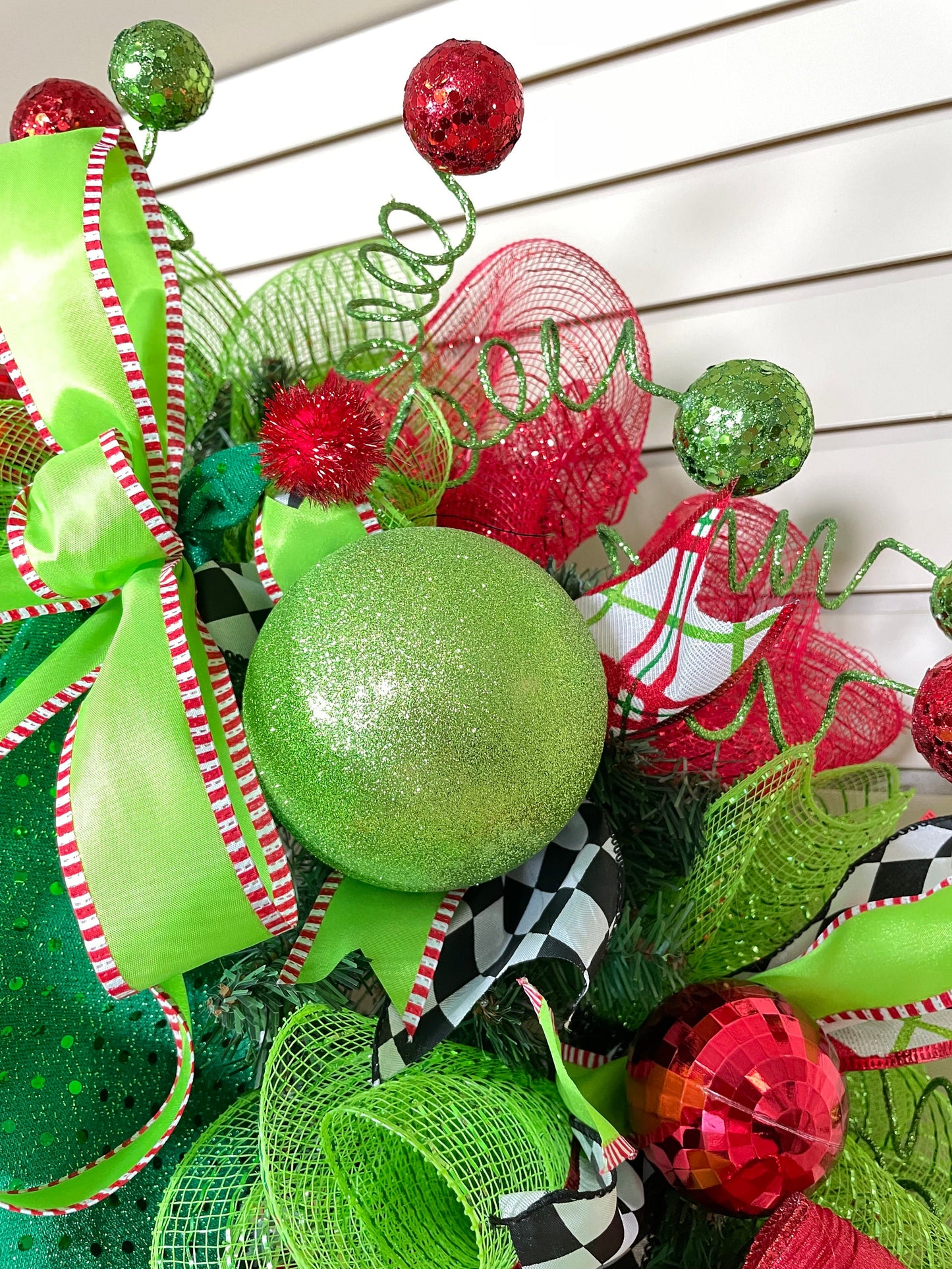 Whimsical Red and Green Christmas elf wreath perfect for front door, porch door, gift or juvenile with 4 ribbon bow with harlequin accents.
