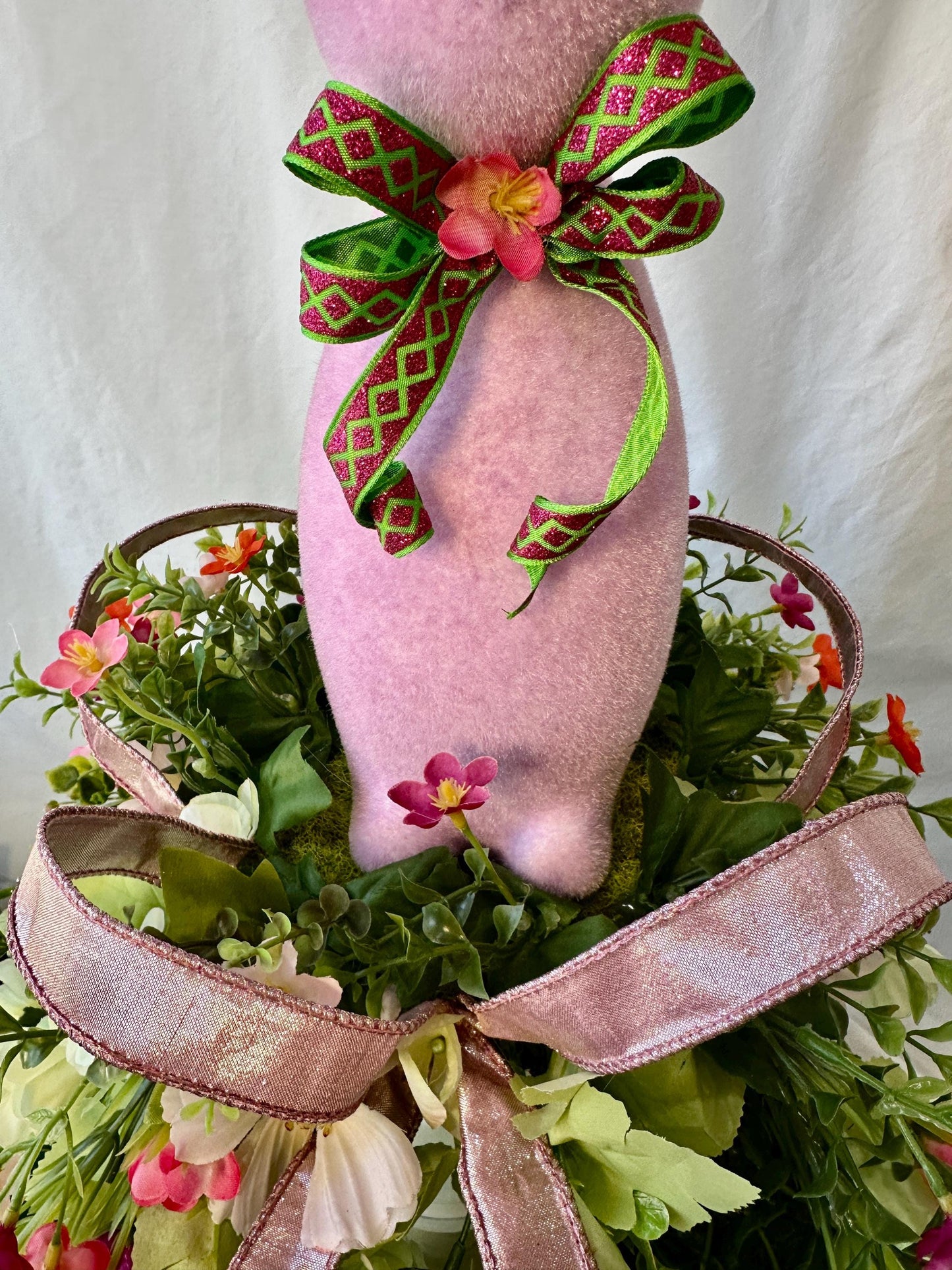 Elevate your Easter Home Decor with this enchanting Flocked Bunny Candlestick Centerpiece on a surrounded by Ribbon and Wispy Flowers.