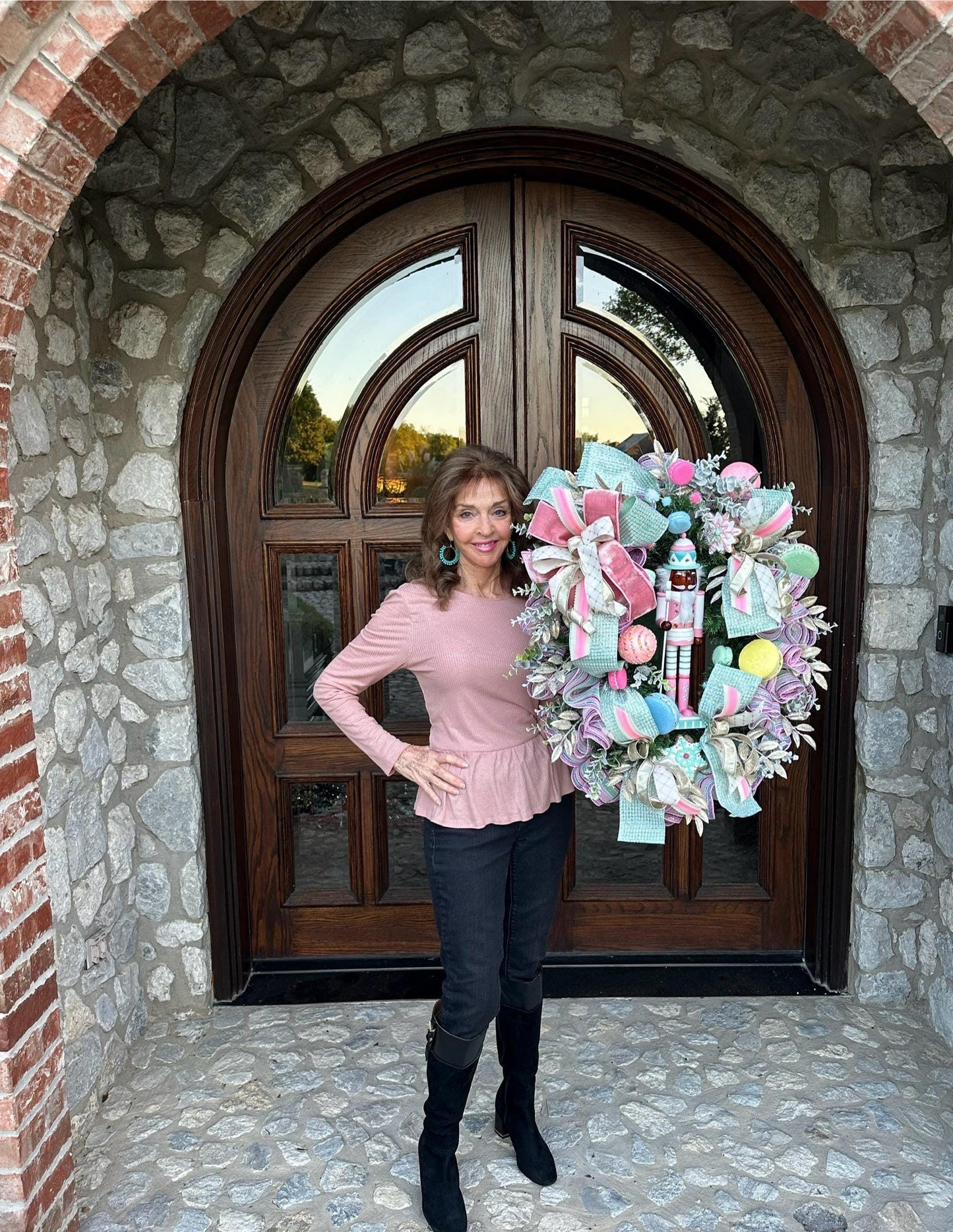 Candyland themed pink and mint green nutcracker Christmas wreath in pastel colors with dark face or light face soldier and sweet treats