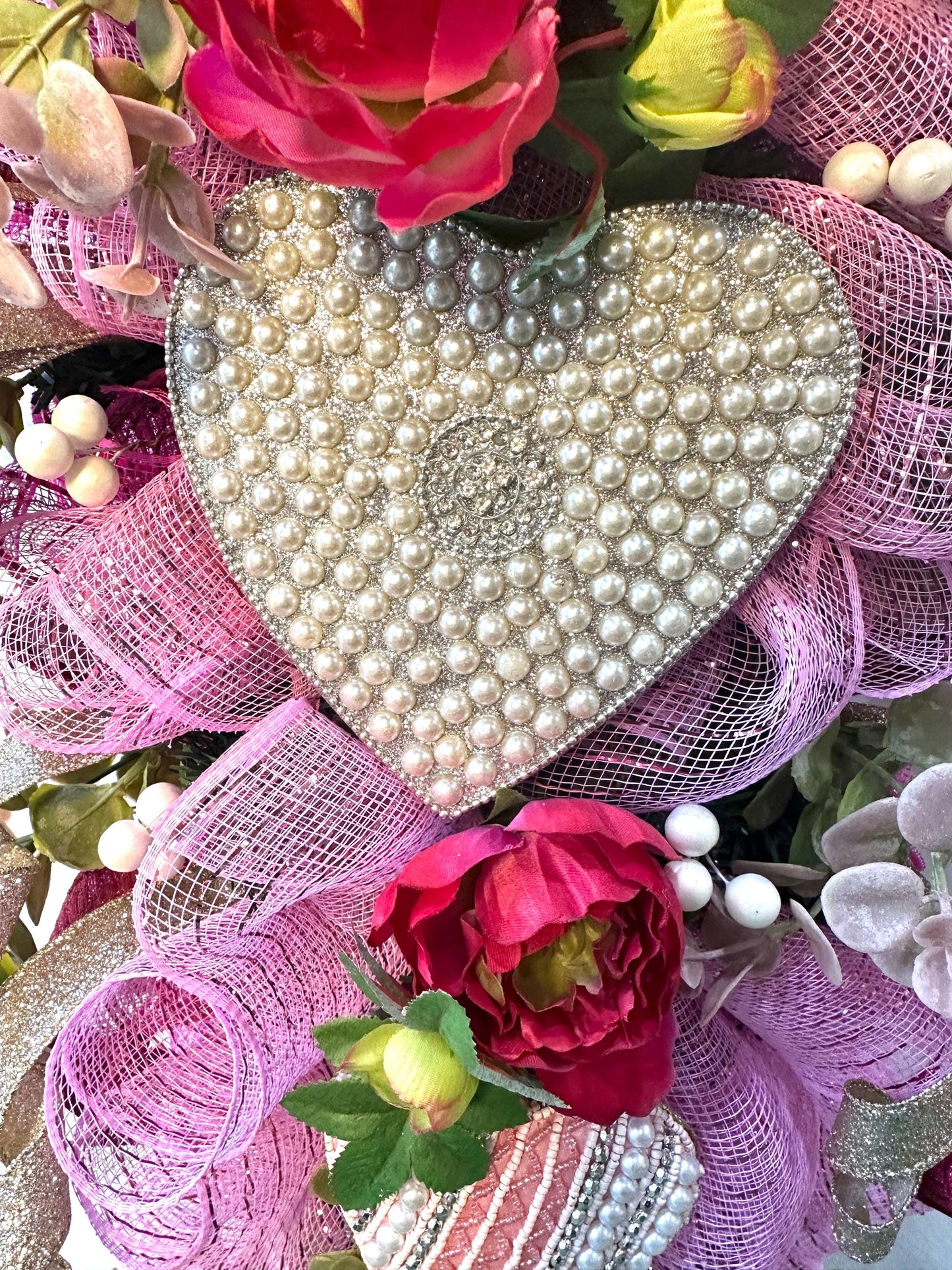Elevate your home decor with this luxury pearl and rhinestone heart wreath accented with peonies and designer ribbons for your front door.