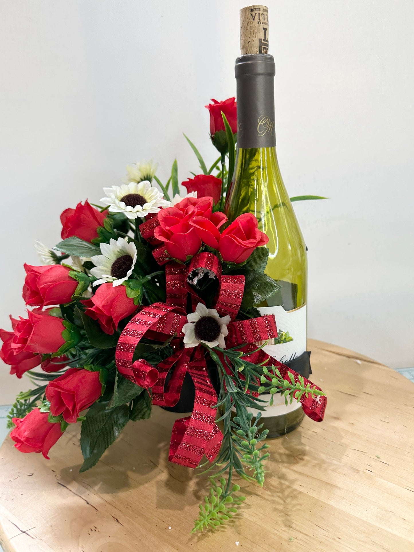 Floral wine bottle bouquet for an environmentally friendly hostess gift, housewarming, party idea, Christmas gift or wine accessory.