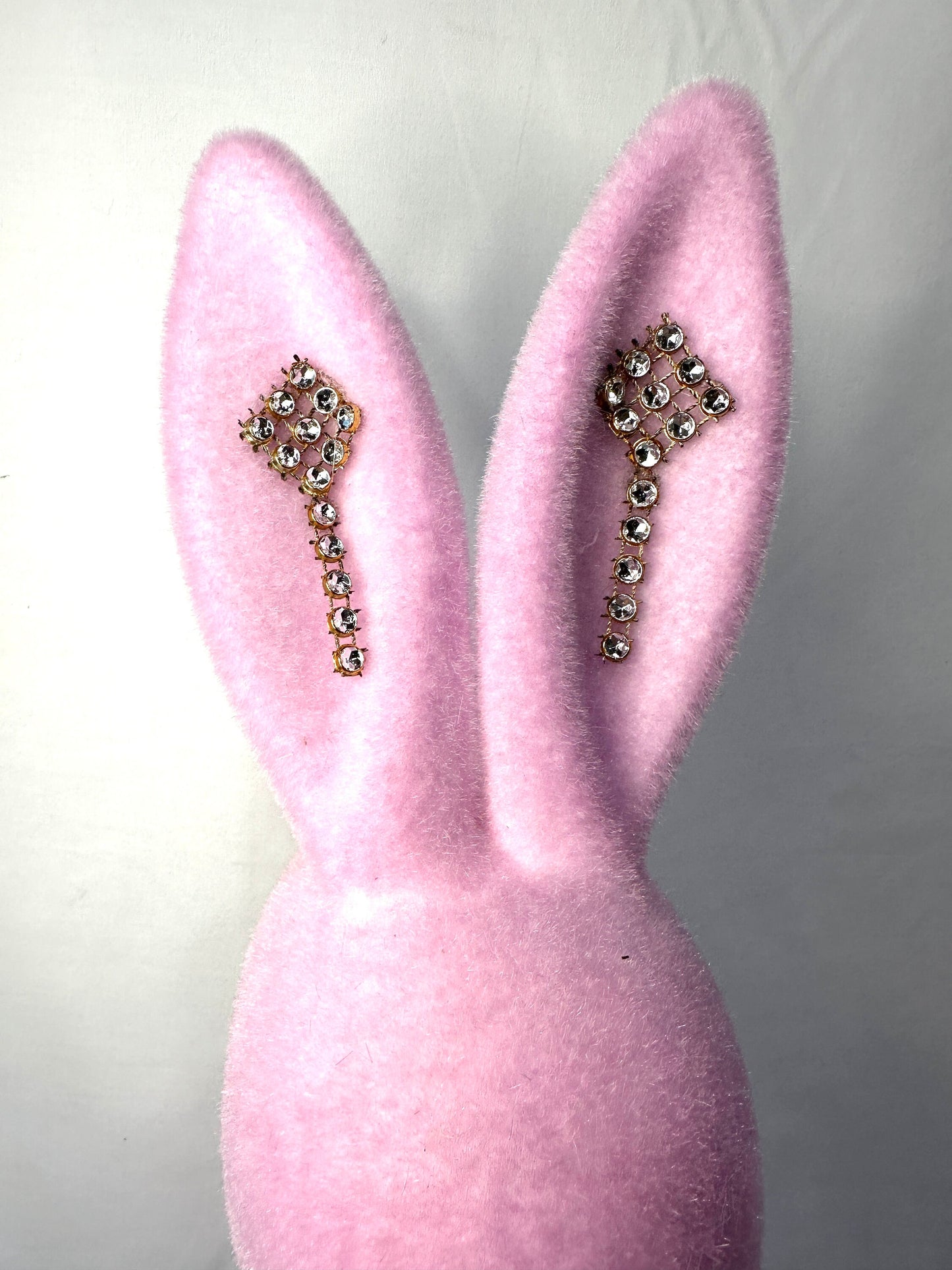 Welcome spring with this charming flocked pink 16" Easter bunny with a rhinestone necklace and earrings. Perfect for Easter your decor.