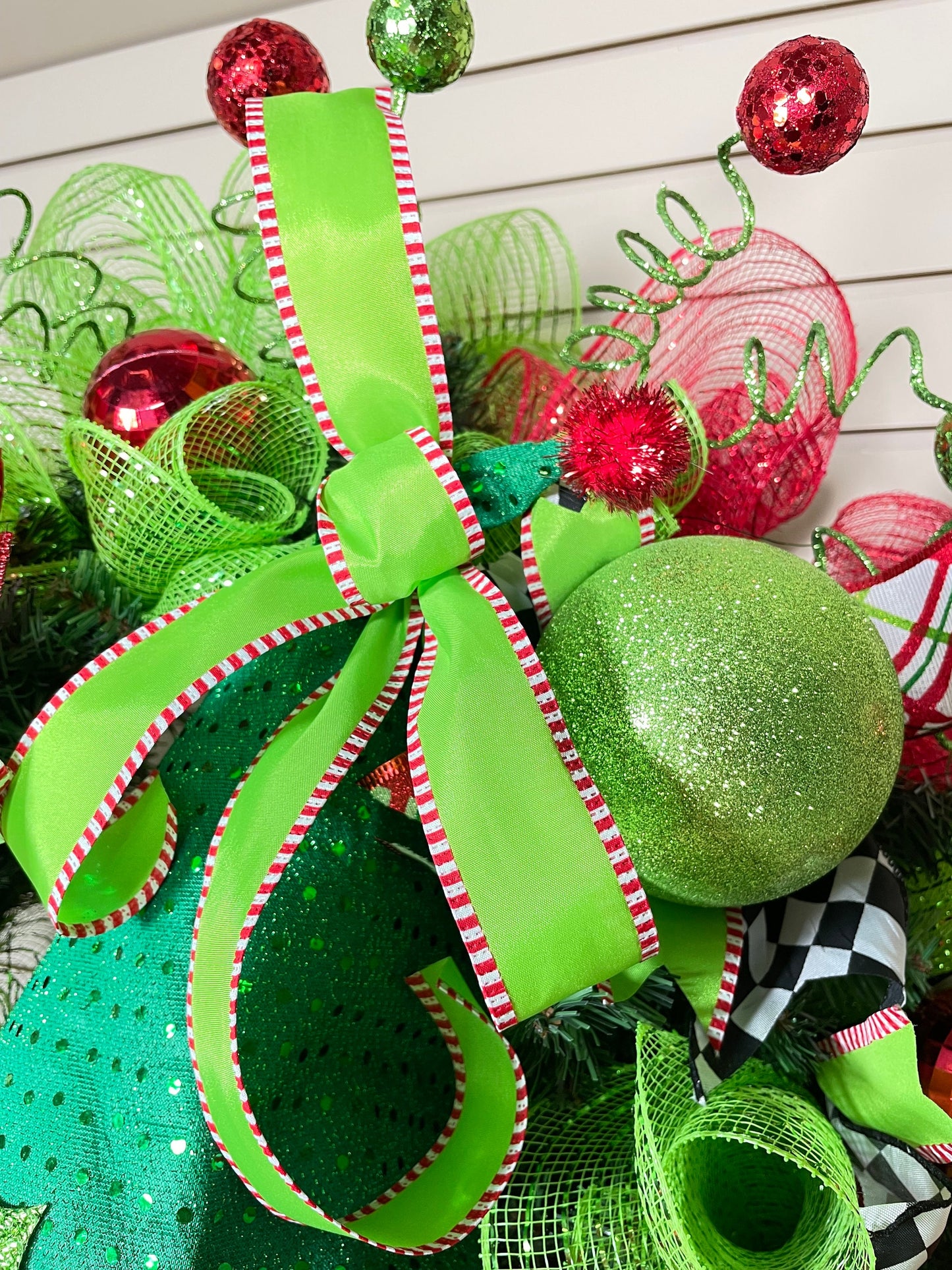 Whimsical Red and Green Christmas elf wreath perfect for front door, porch door, gift or juvenile with 4 ribbon bow with harlequin accents.