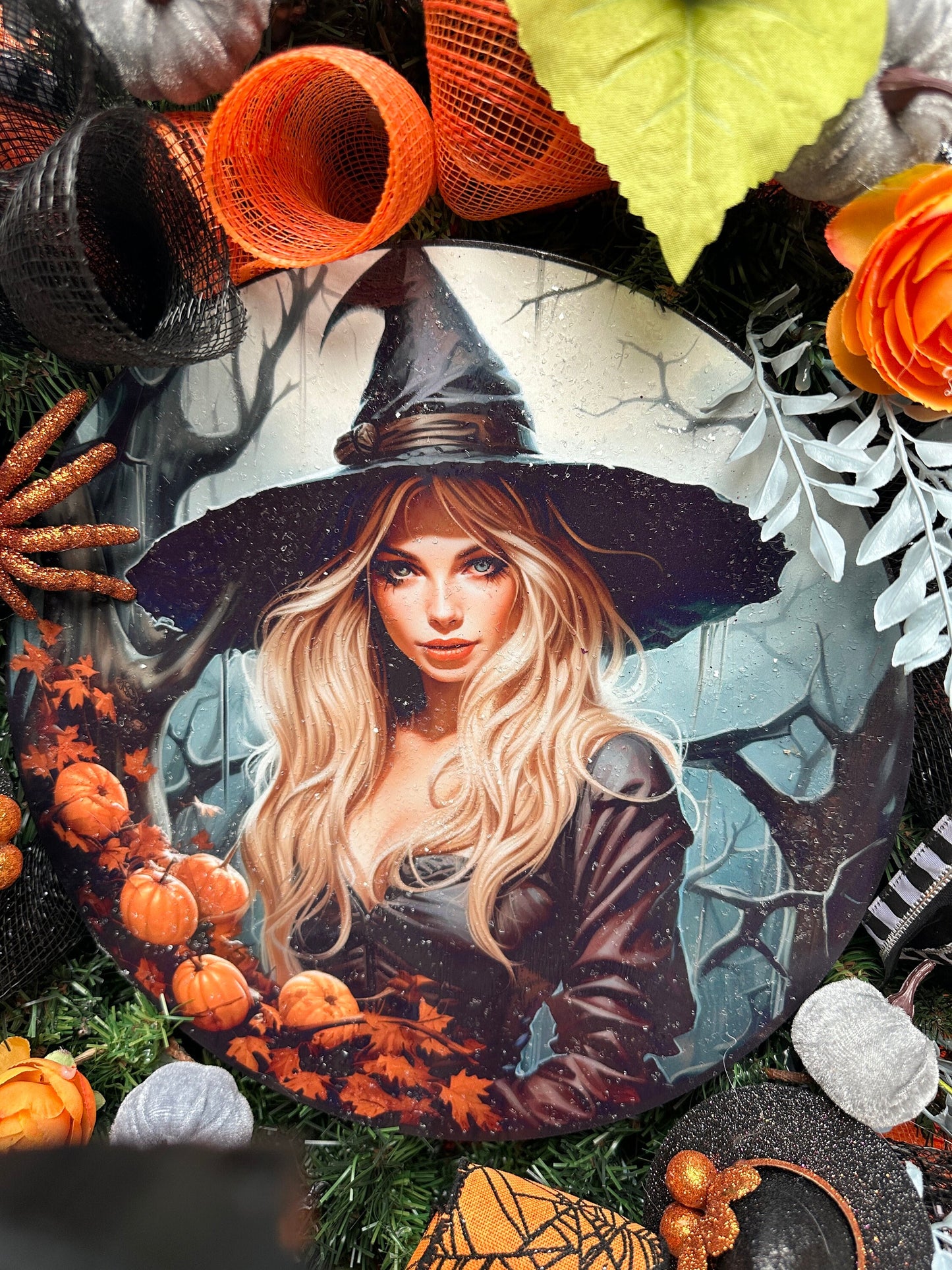 Wreath with glam witch sign, pumpkins, spider, witch hats and blue leaves gives a dark and moody Halloween vibe and add magic to your door.