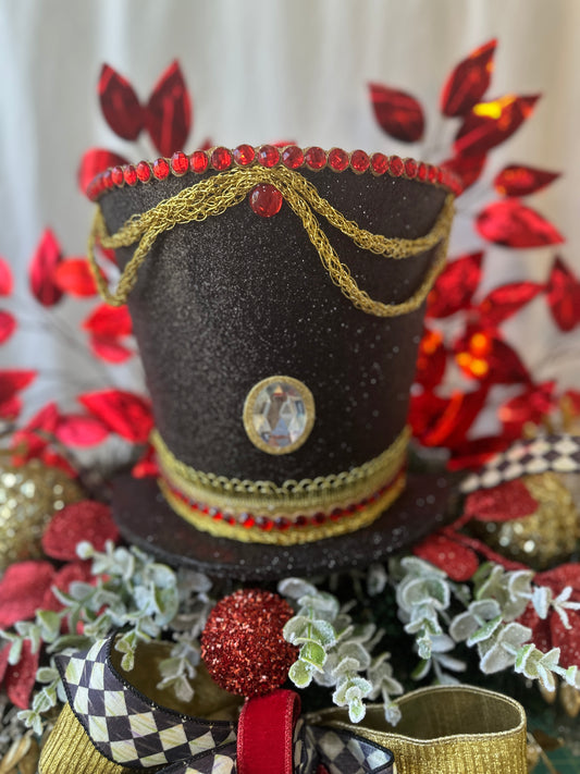 Sandye 3 piece traditional nutcracker christmas mantle decor with designer harlequin ribbon, nutcracker hat, christmas ornaments, velvet ribbon and drums.