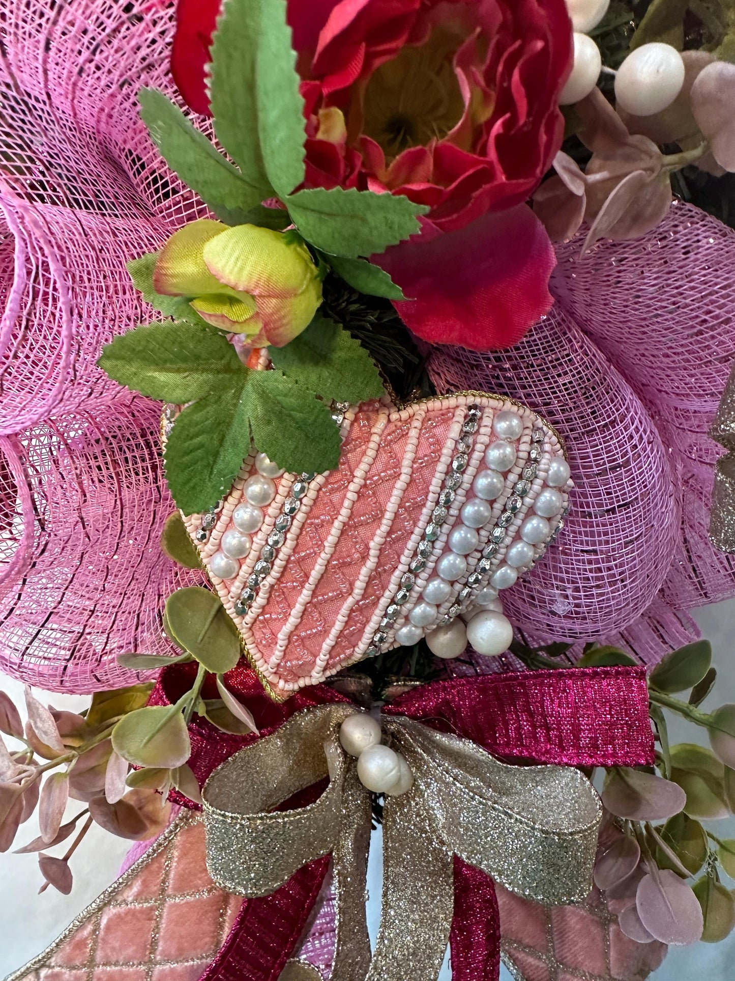 Elevate your home decor with this luxury pearl and rhinestone heart wreath accented with peonies and designer ribbons for your front door.