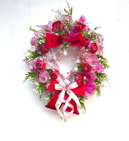 Shabby Chic Romantic Valentine Wreath Featuring a Gold & Pink Heart surrounded by Fuchsia Roses, Pink Berries, and Velvet Bows.