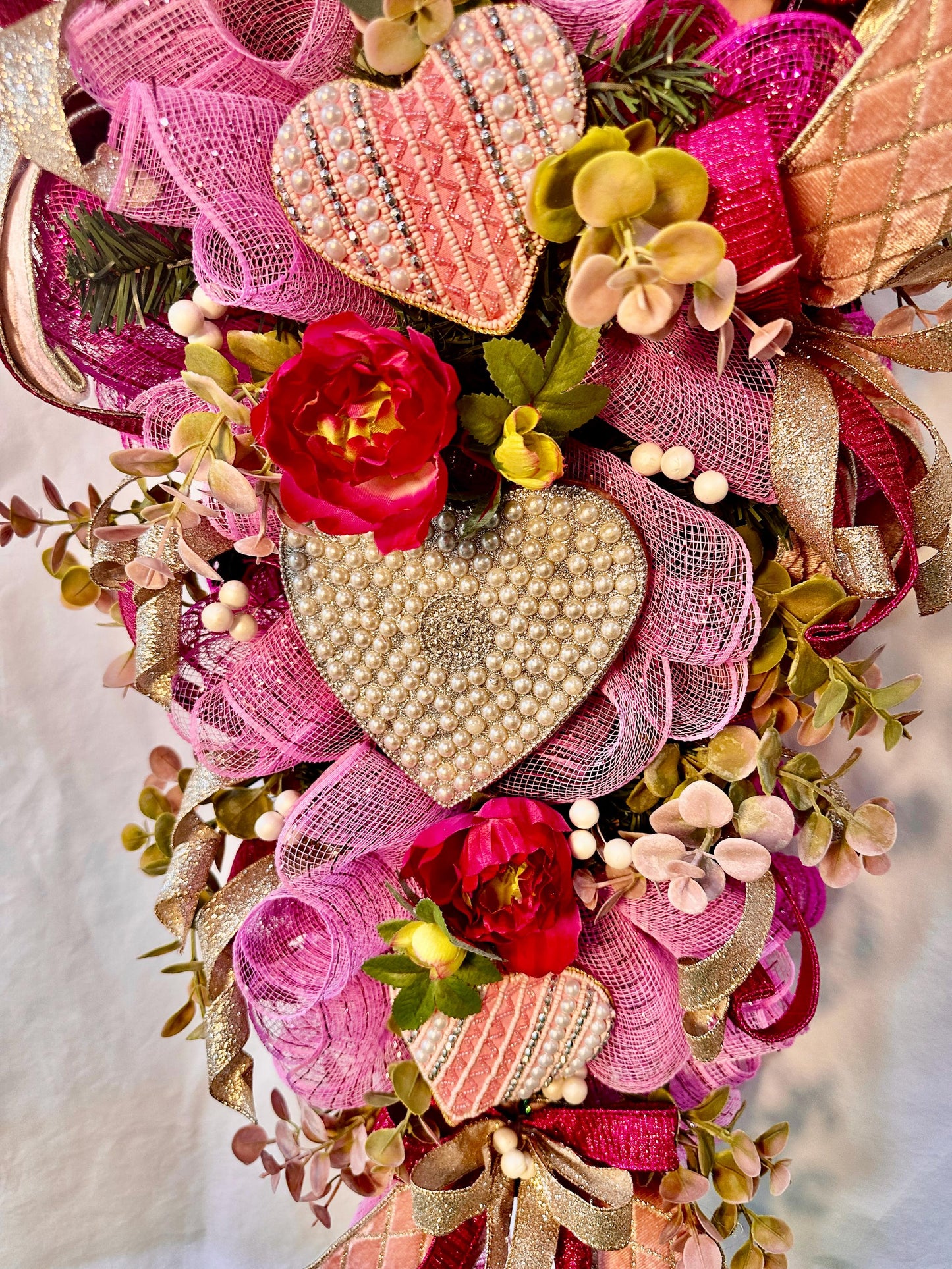 Elevate your home decor with this luxury pearl and rhinestone heart wreath accented with peonies and designer ribbons for your front door.