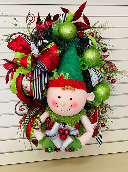 Whimsical Christmas elf in traditional colors is a perfect front door or porch winter wreath, child's room accessory or holiday gift.