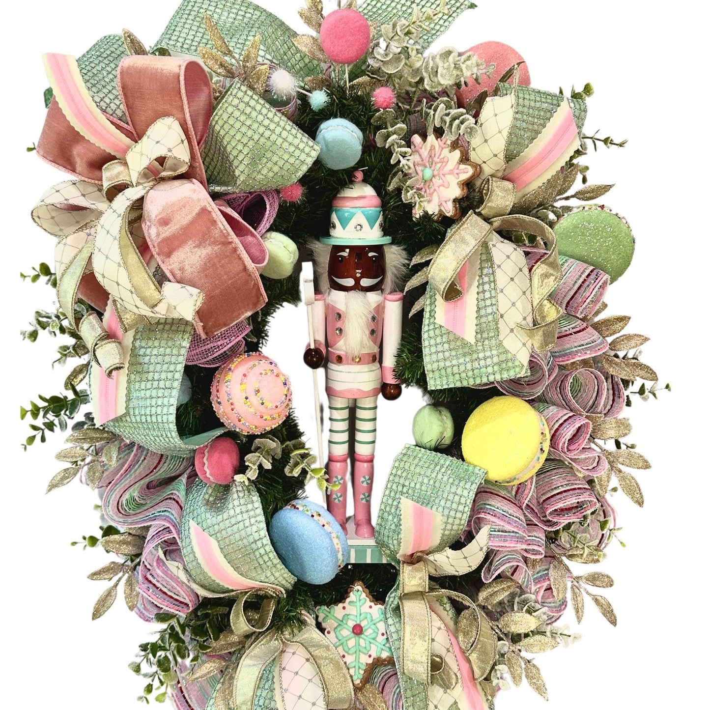 Candyland themed pink and mint green nutcracker Christmas wreath in pastel colors with dark face or light face soldier and sweet treats