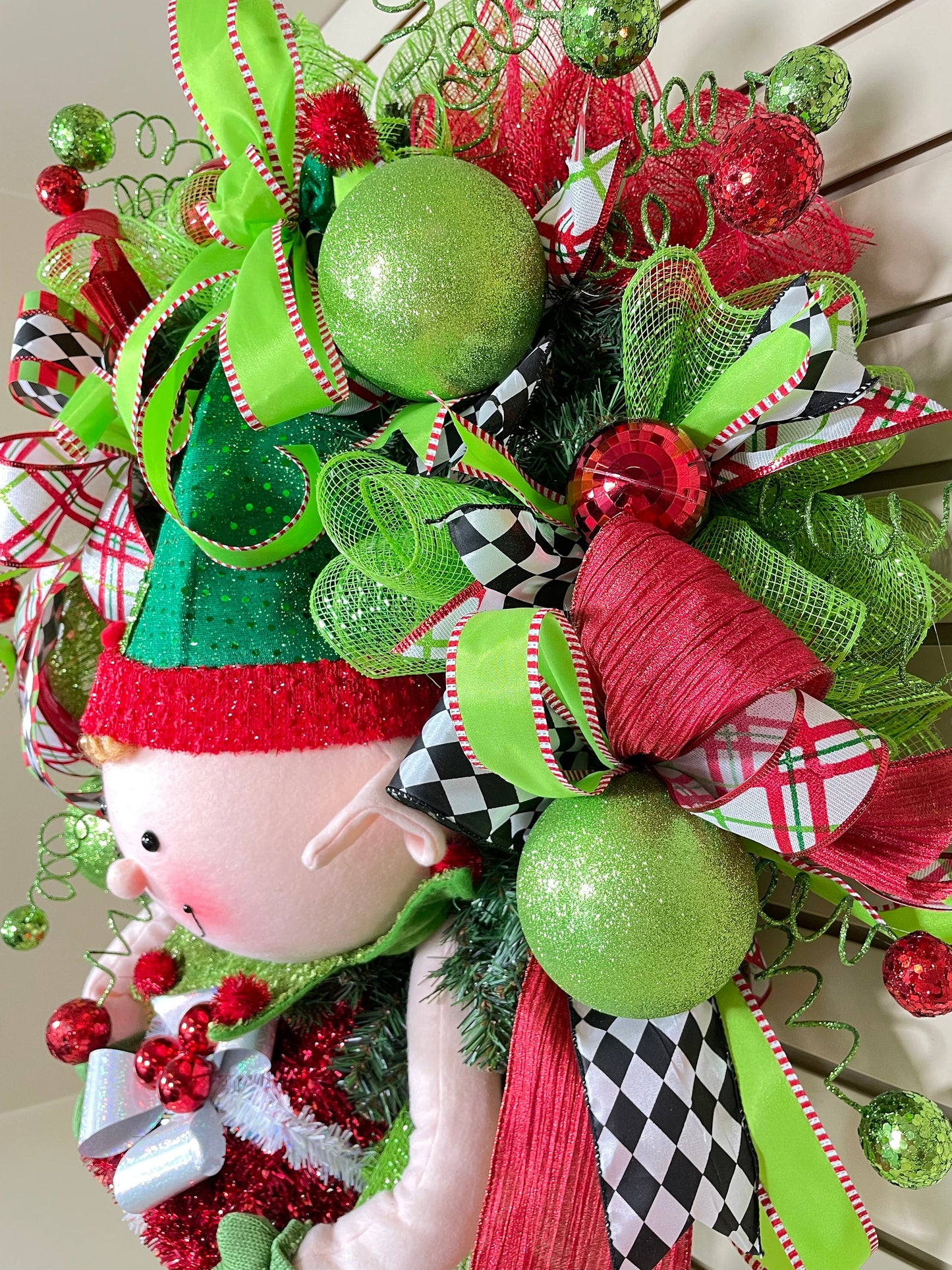 Whimsical Red and Green Christmas elf wreath perfect for front door, porch door, gift or juvenile with 4 ribbon bow with harlequin accents.