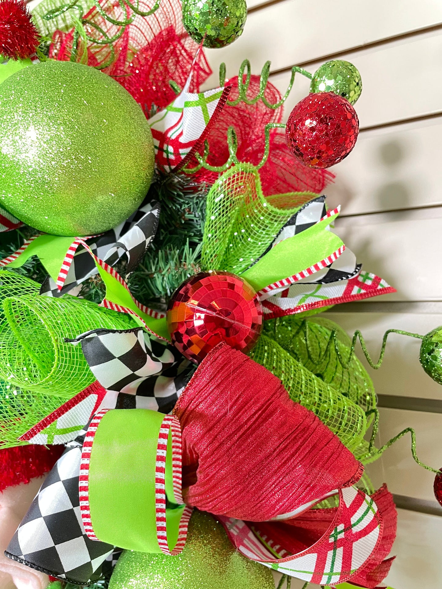 Whimsical Red and Green Christmas elf wreath perfect for front door, porch door, gift or juvenile with 4 ribbon bow with harlequin accents.