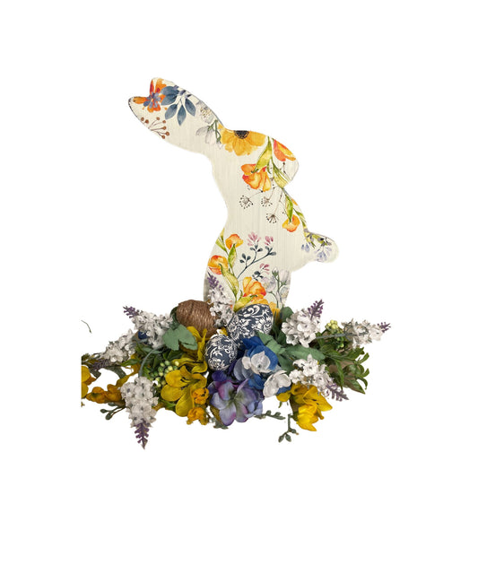 Set of 3 Wooden Standing Painted Easter Bunnies embellished with Blue, Yellow, and Lavender Flowers and Greenery for Easy Holiday Decor.