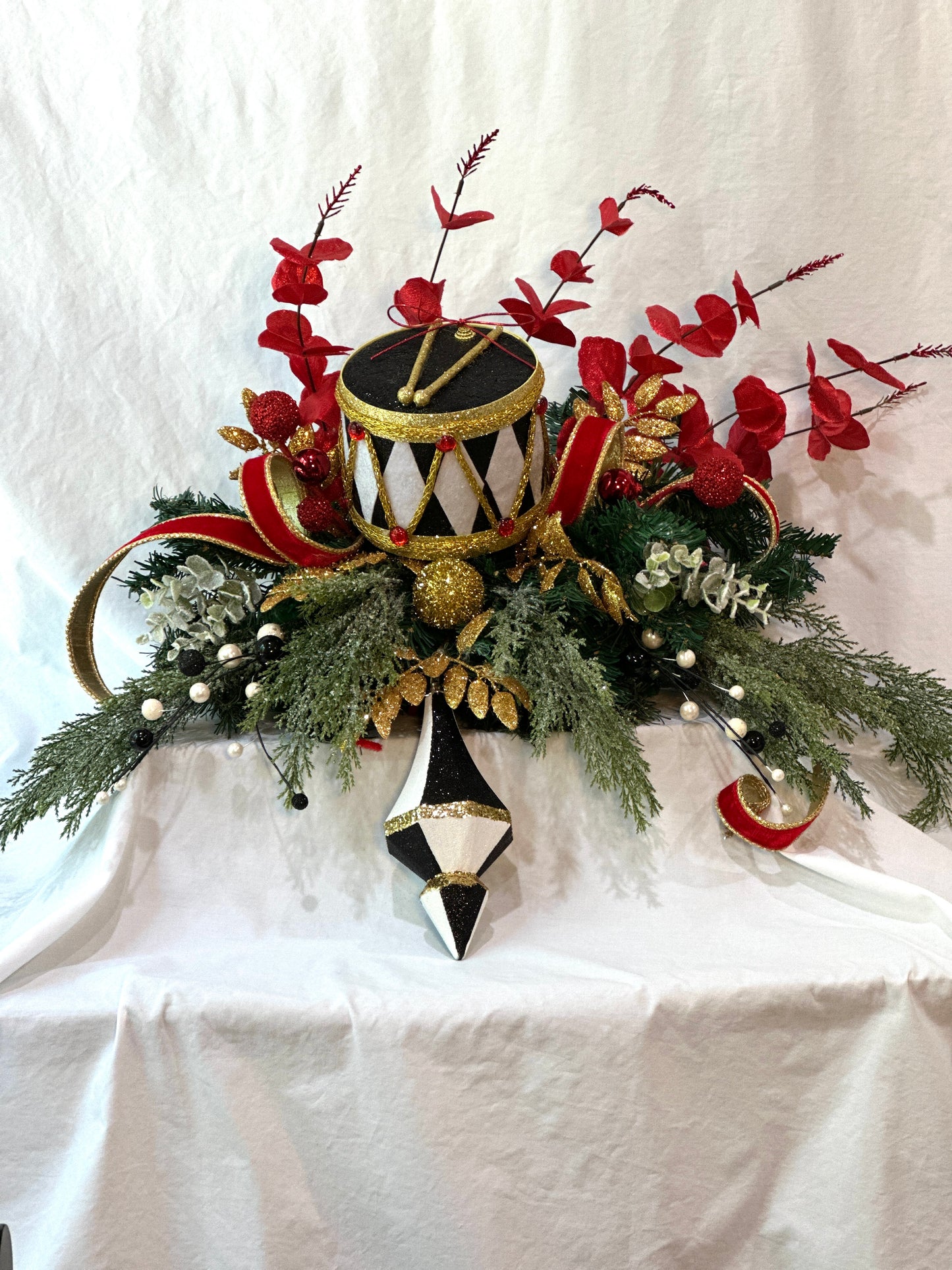 3 piece traditional nutcracker christmas mantle decor with designer harlequin ribbon, nutcracker hat, christmas ornaments, velvet ribbon and drums. (Copy) (Copy)