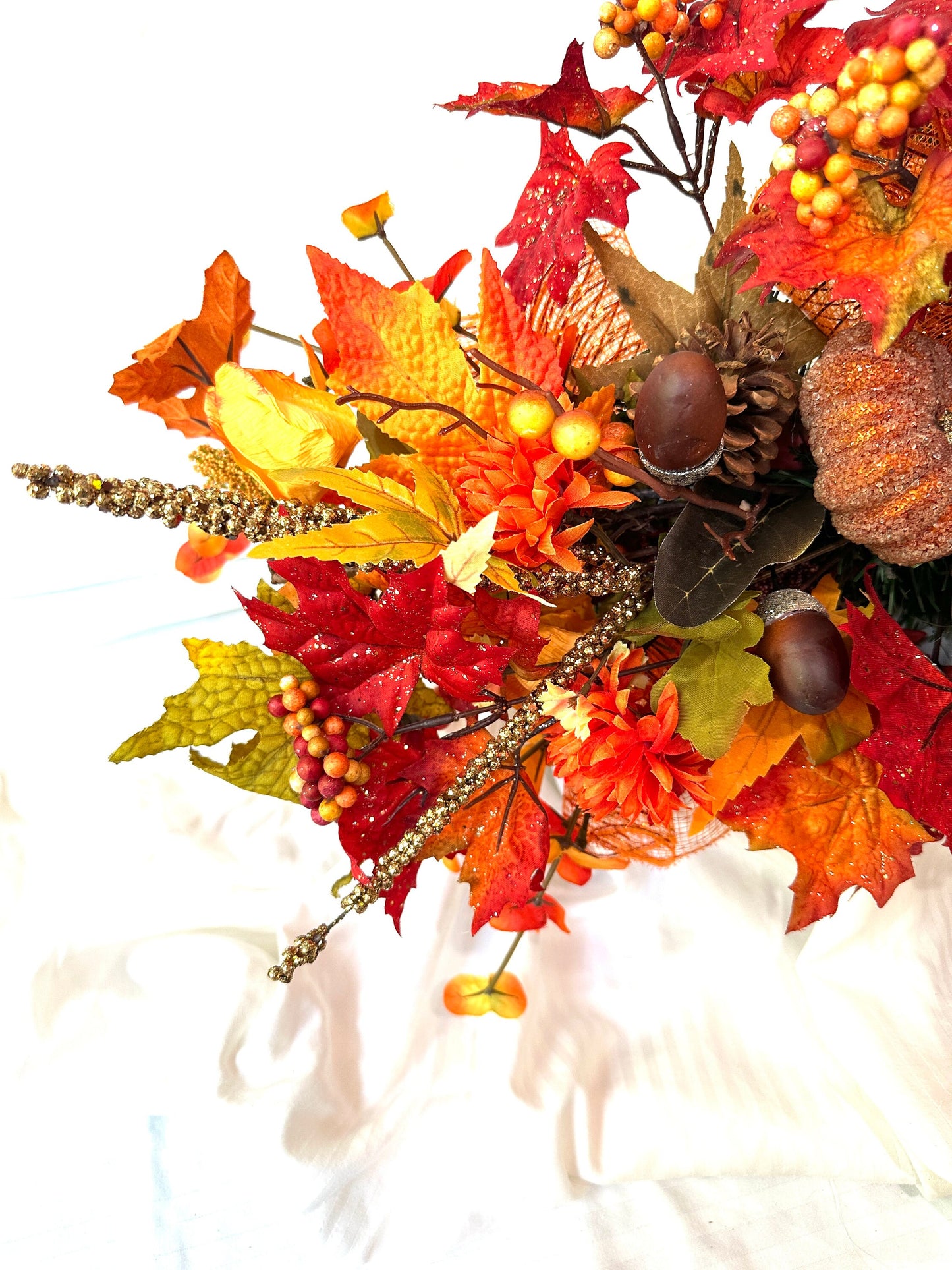 Welcome the beauty of Autumn into your home with our Harvest or Fall centerpiece with twig balls, natural elements, acorns and pumpkins.