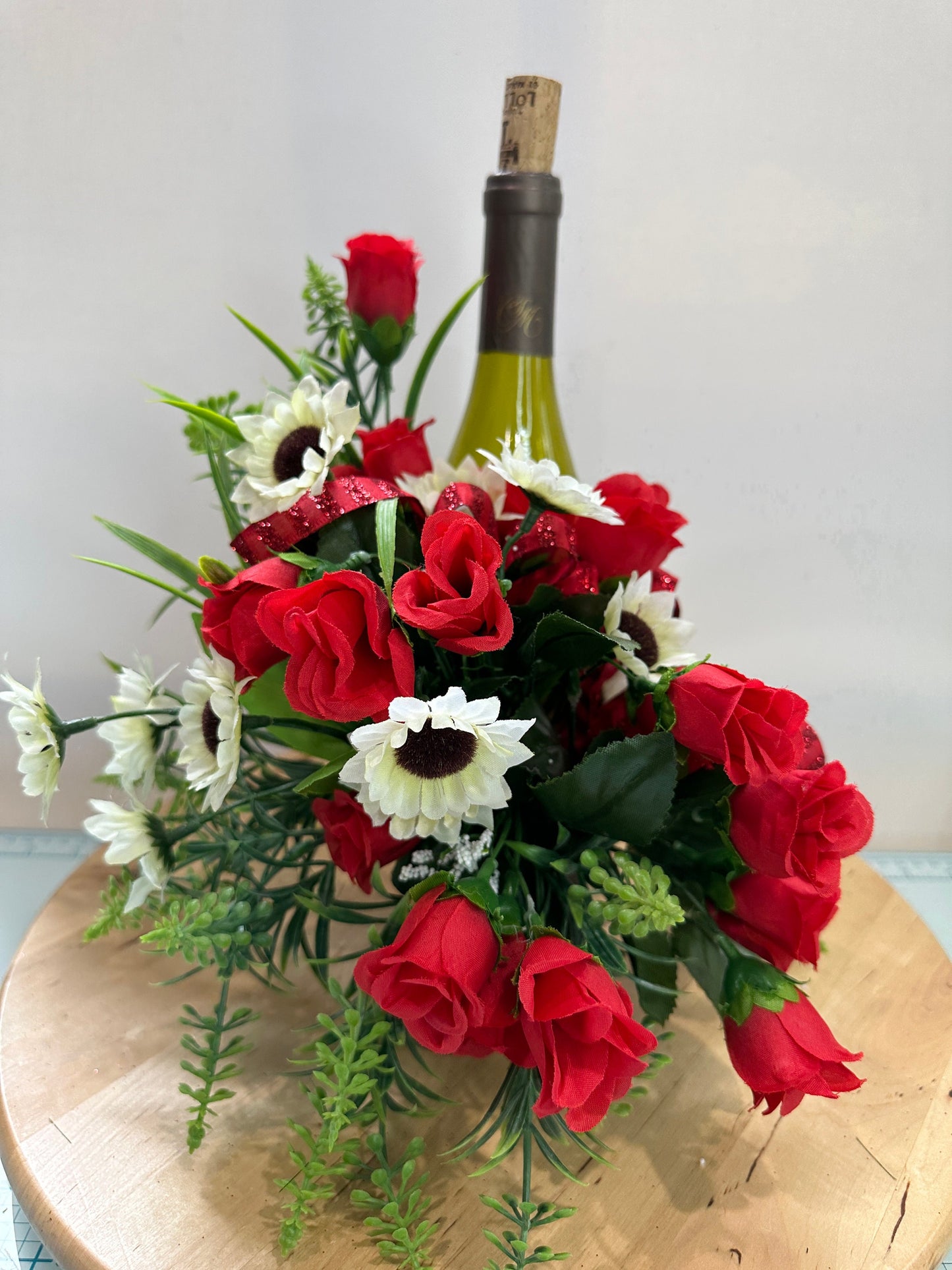 Floral wine bottle bouquet for an environmentally friendly hostess gift, housewarming, party idea, Christmas gift or wine accessory.