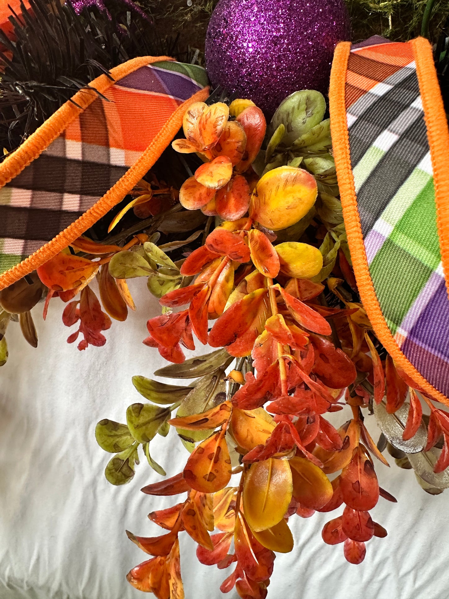 Halloween plaid ribbon with fall leaves and ornament in mantel decor