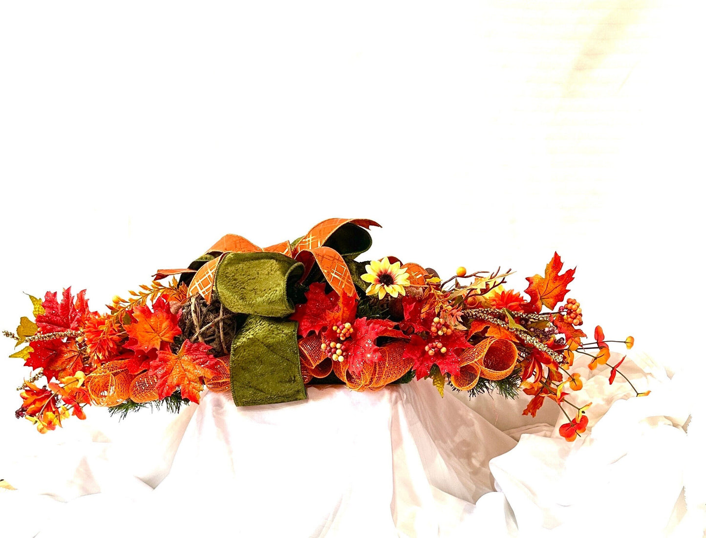 Welcome the beauty of Autumn into your home with our Harvest or Fall centerpiece with twig balls, natural elements, acorns and pumpkins.